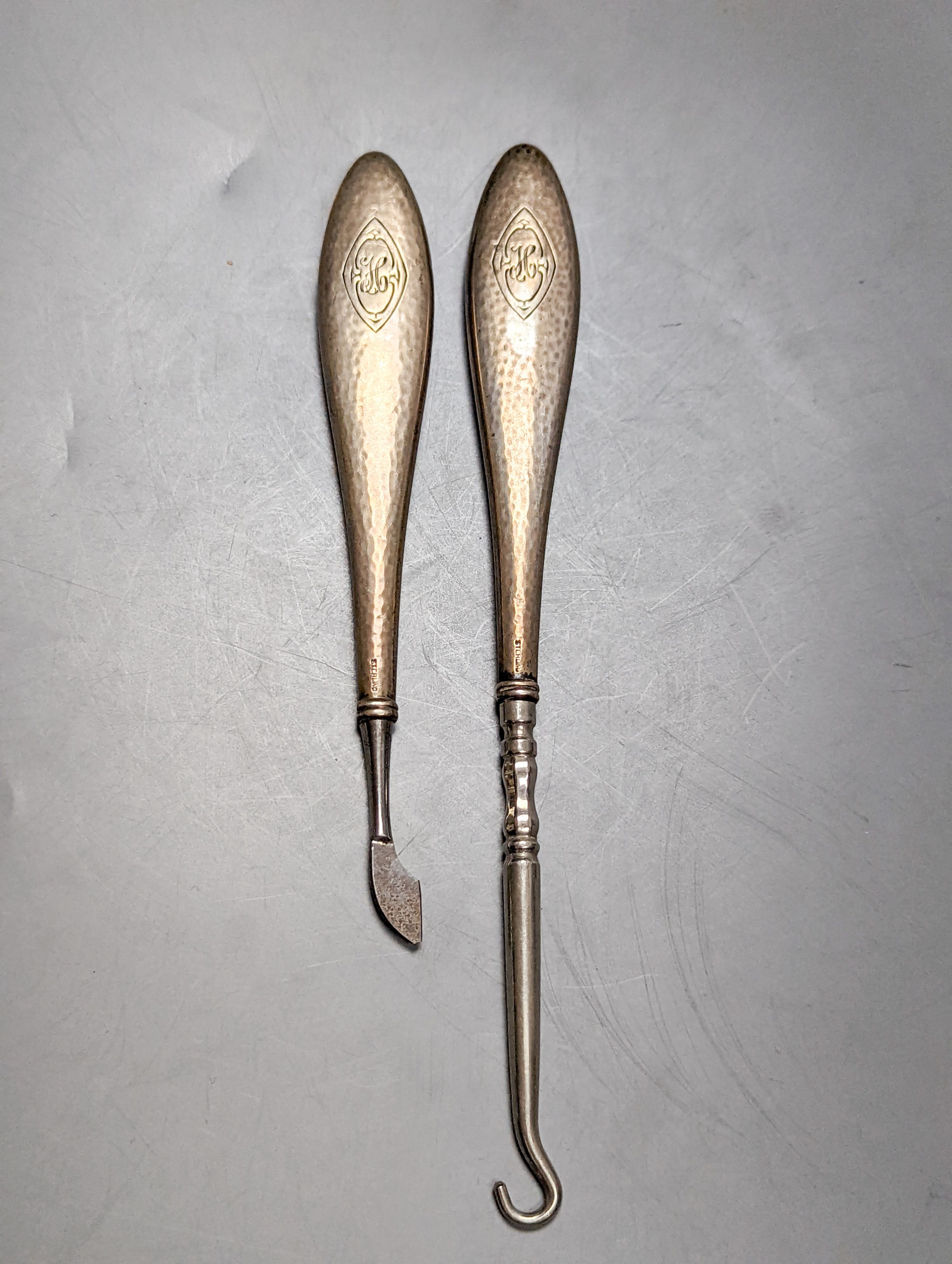 A cased Victorian engraved gilt white metal and coral set double ended scent bottle, 13.4cm, a silver cigar cutter, a belt, a silver buckle, gilt and cranberry perfume bottle, etc.